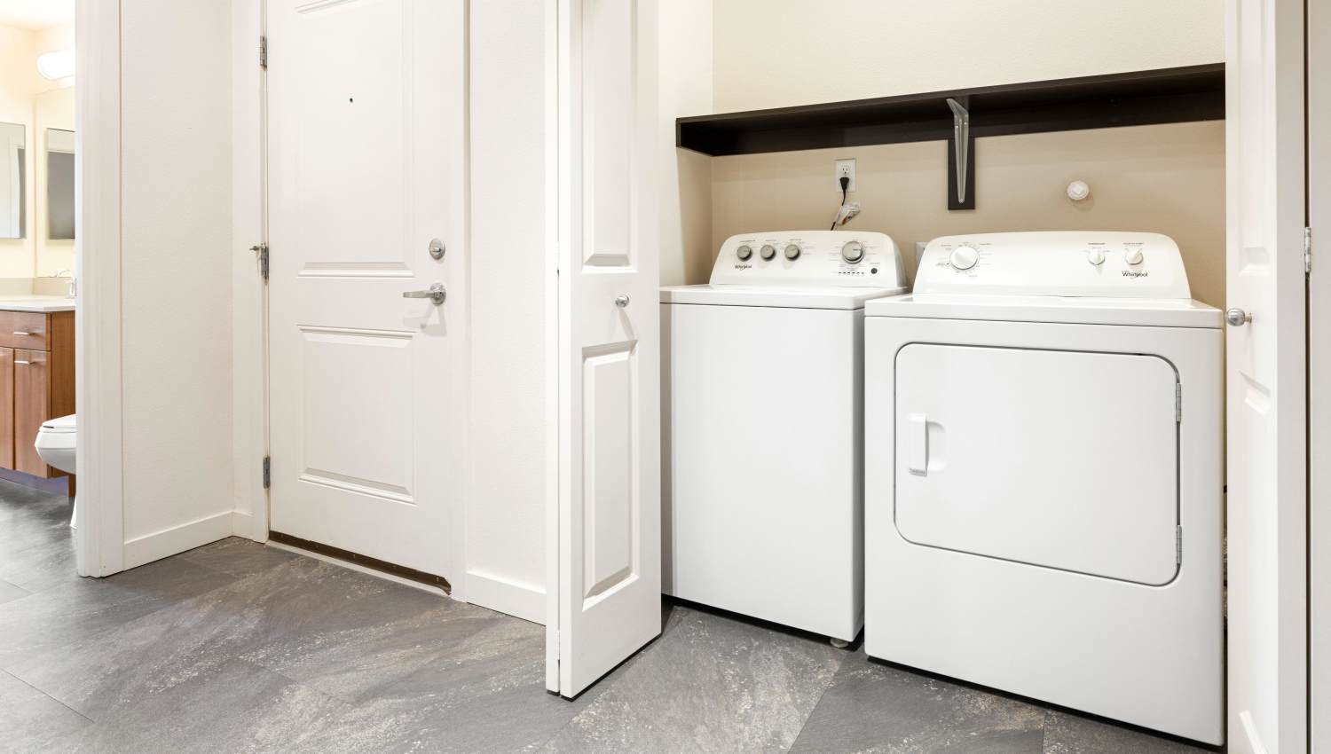 A laundry room with washer and dryer at Olympus Alameda in Albuquerque, New Mexico