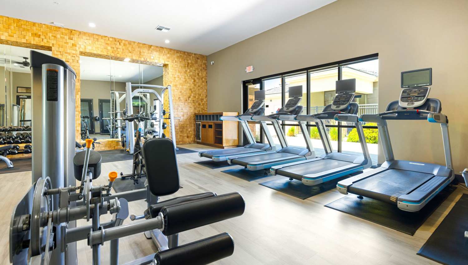 A gym with exercise equipment at Olympus Alameda in Albuquerque, New Mexico