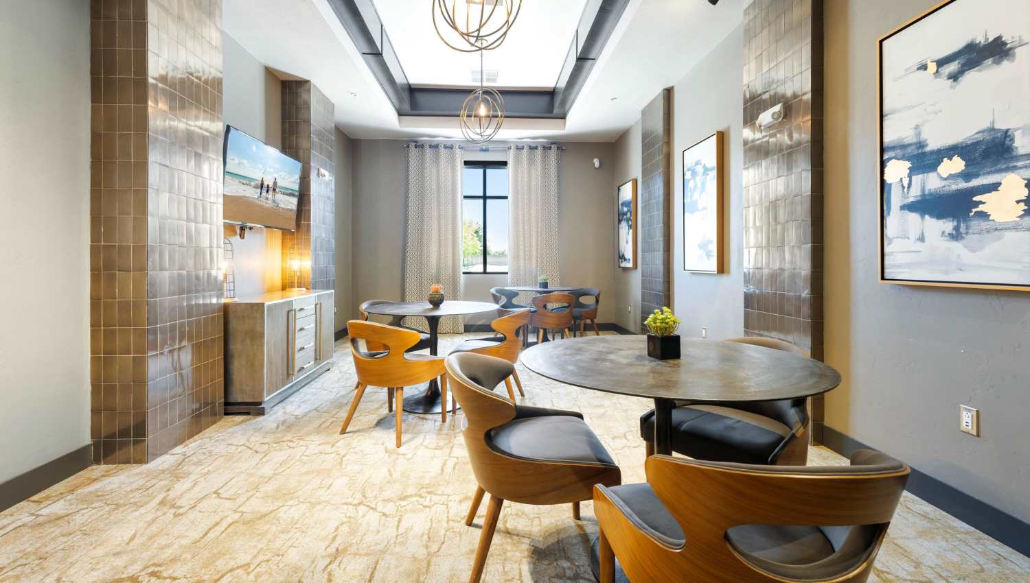 A room with a round table and chairs at Olympus Alameda in Albuquerque, New Mexico