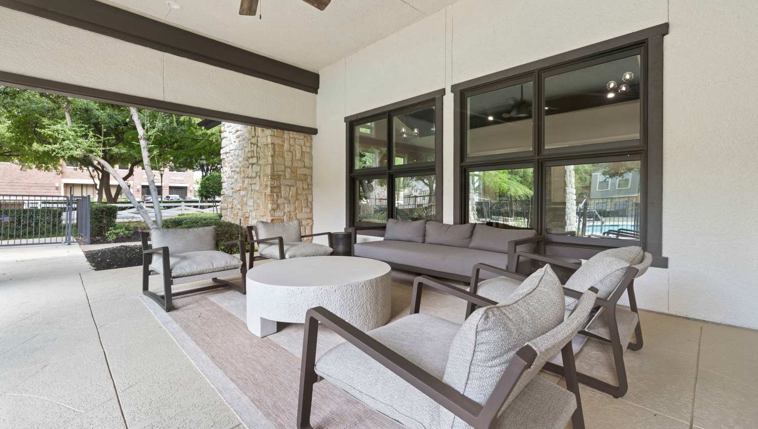 A patio area with chairs and a fan at Olympus Town Center in Keller, Texas