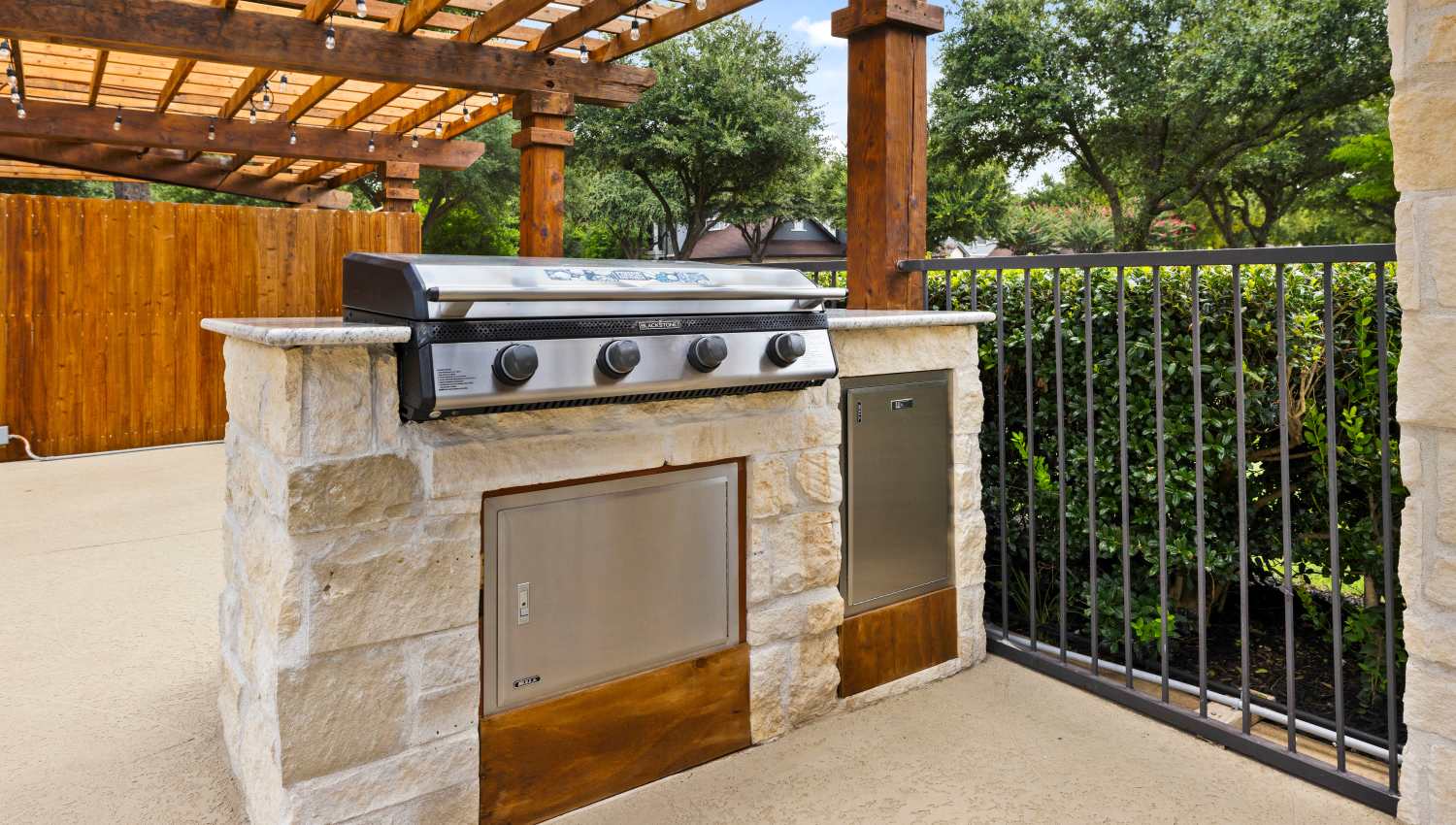 A grill on a patio at Olympus Town Center in Keller, Texas