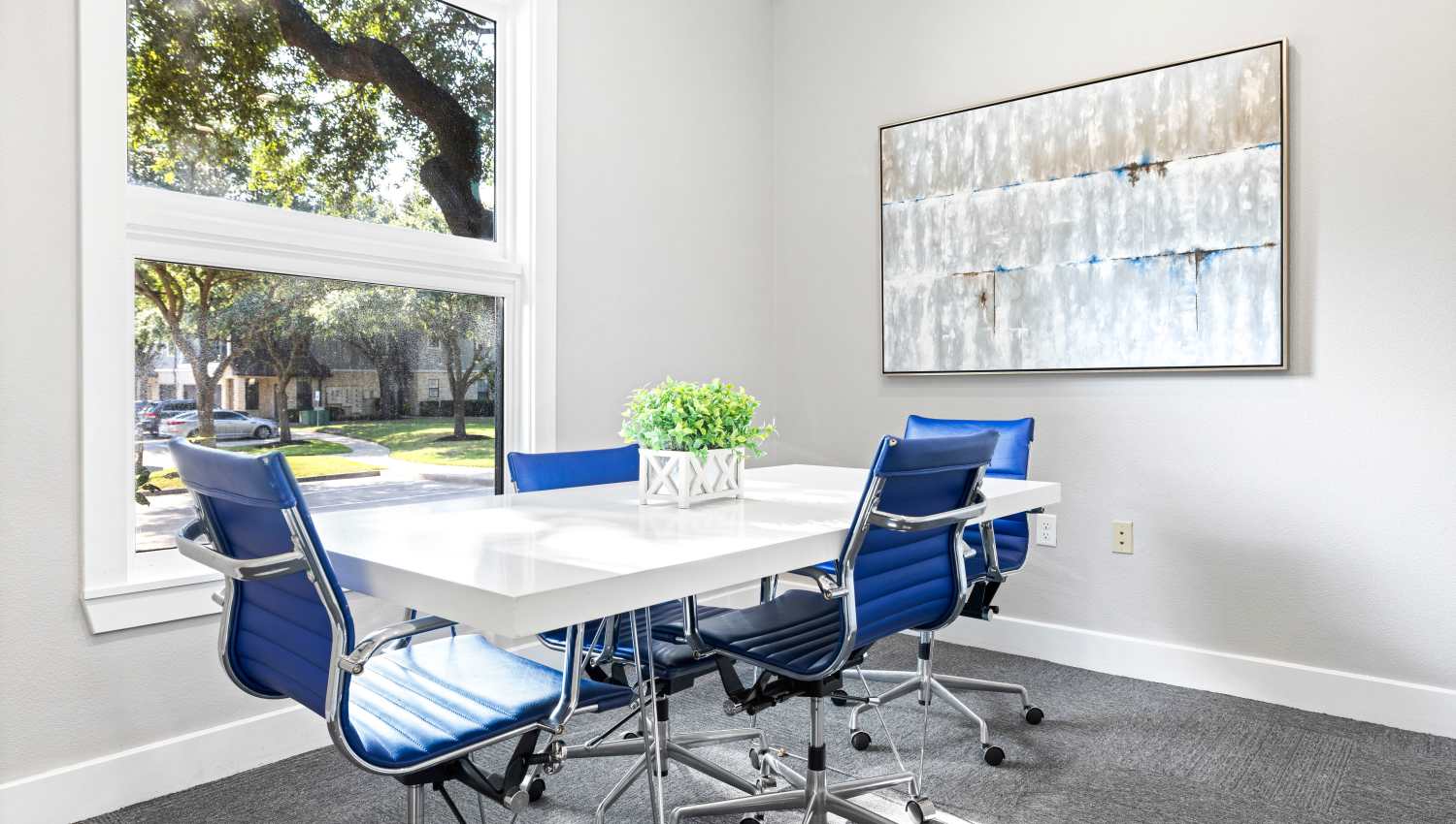 Meeting room with a table and chairs at Olympus Town Center in Keller, Texas