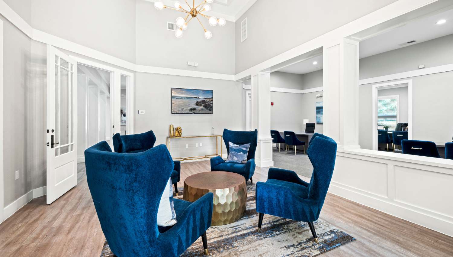 A room with blue chairs and a table  at Olympus Town Center in Keller, Texas