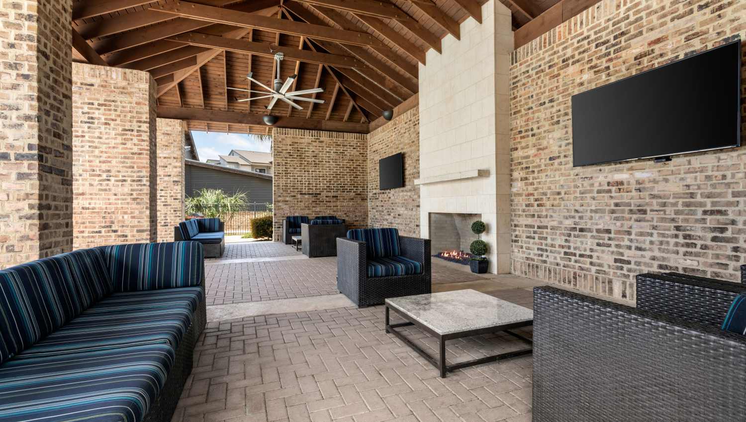 Seating area near swimming pool  at Tacara at Westover Hills in San Antonio, Texas