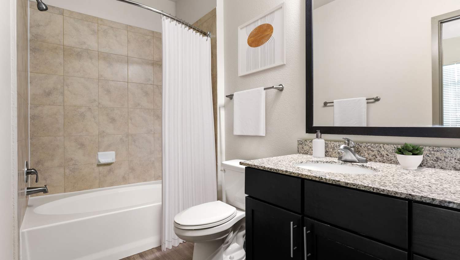 Model unit bathroom and toilet at Tacara at Westover Hills in San Antonio, Texas