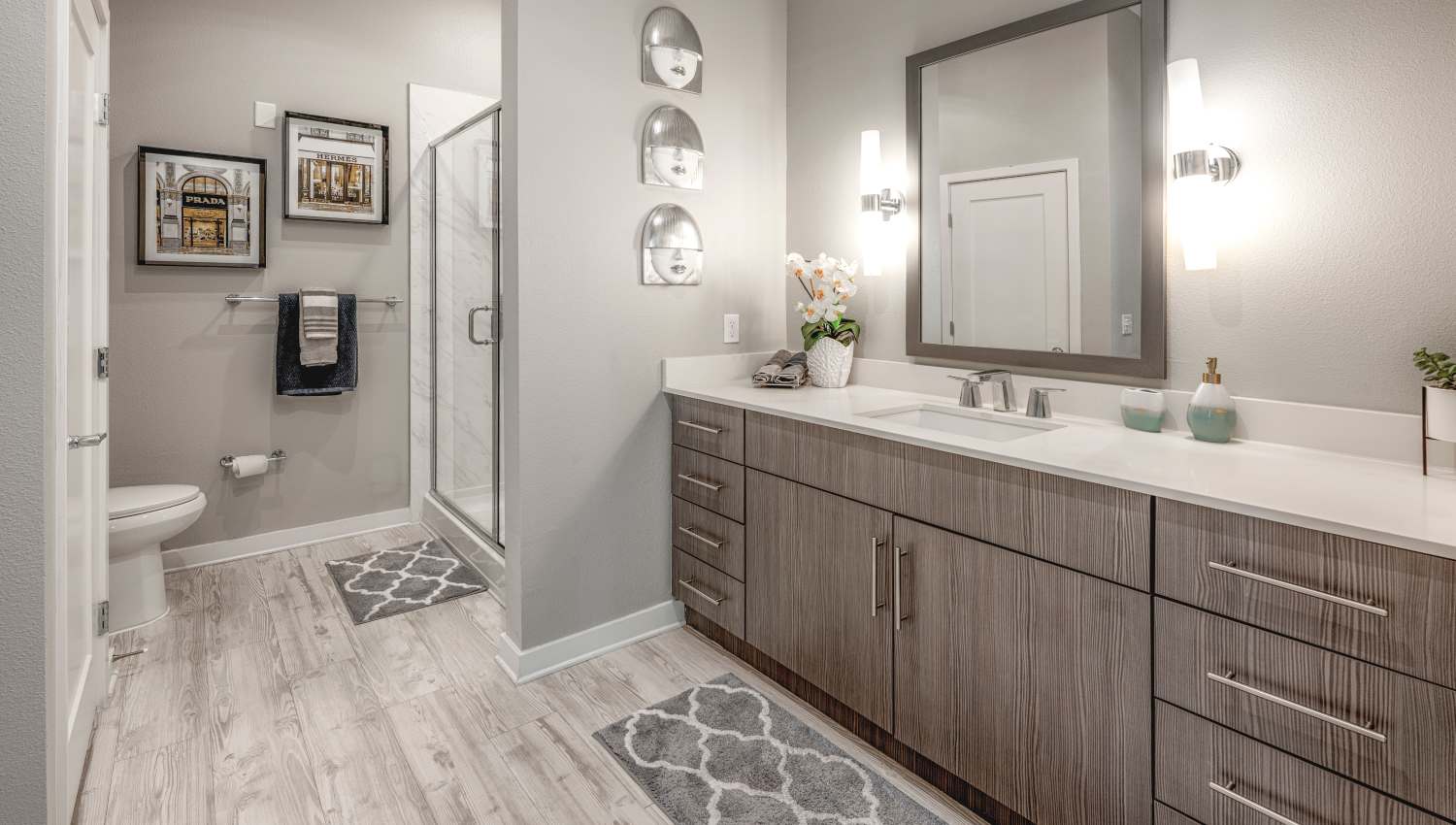 Ultra-modern bathroom with a vanity mirror and storage at 930 Central Flats in St Petersburg, Florida