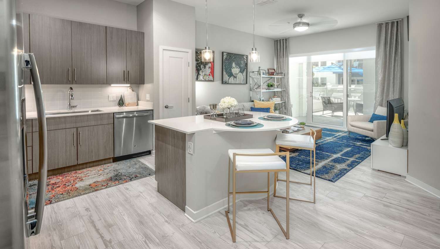 Dining and kitchen areas in the open-concept model home at 930 Central Flats in St Petersburg, Florida