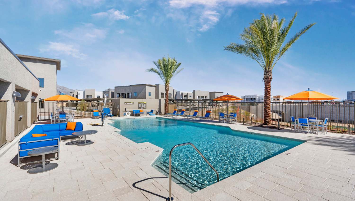 Pool area with palm tree surrounded at Olympus at Arroyo Verde in Tucson, Arizona