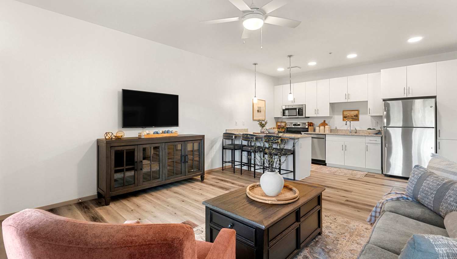 Living room with television at Olympus at Arroyo Verde in Tucson, Arizona