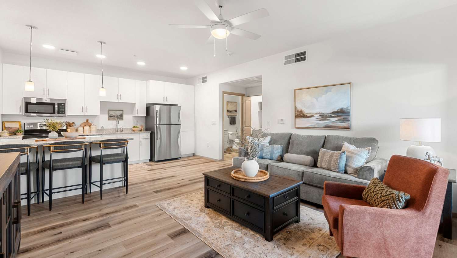 Living room with ceiling fan at Olympus at Arroyo Verde in Tucson, Arizona