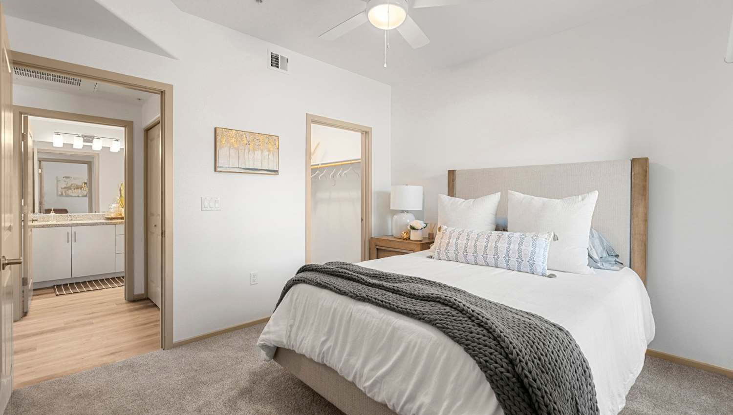 Bedroom with side table lamp at Olympus at Arroyo Verde in Tucson, Arizona