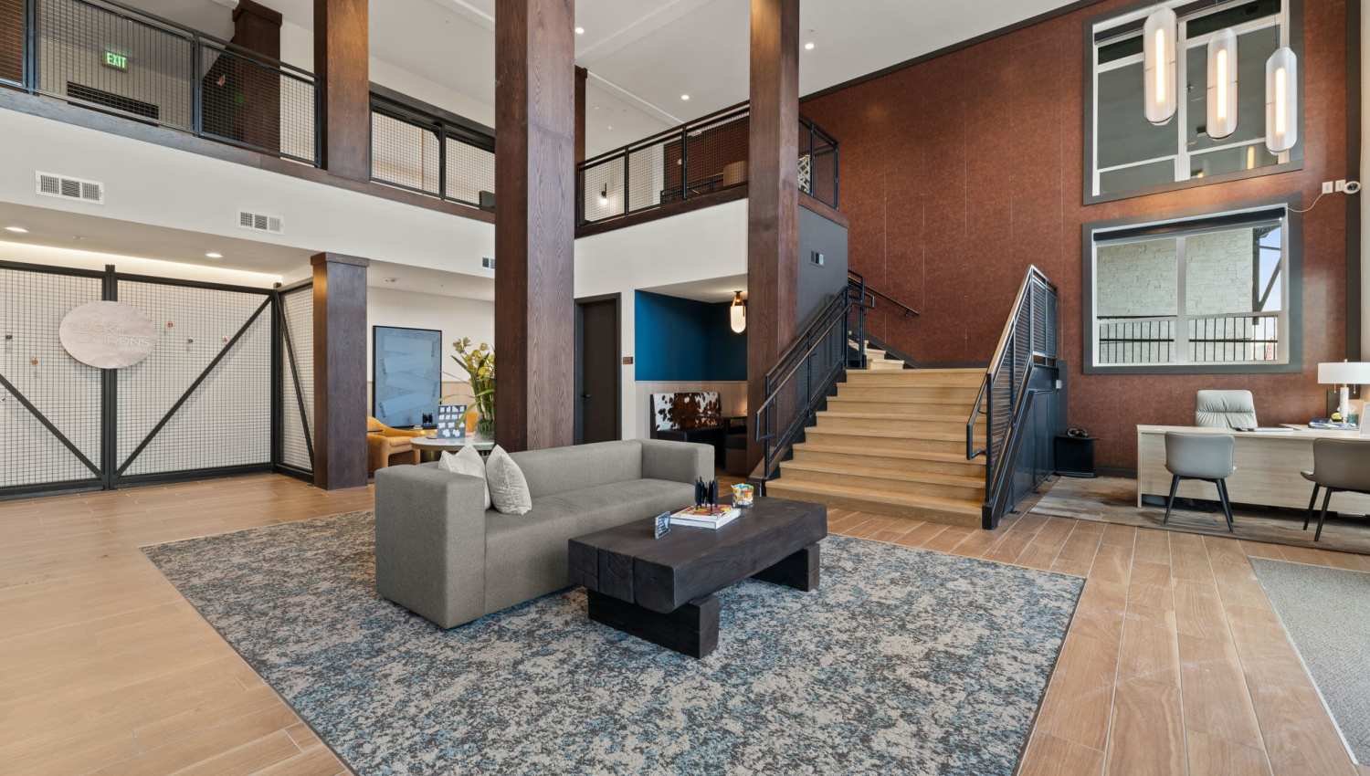 A community clubhouse featuring a staircase at The Lock at Flatirons in Broomfield, Colorado