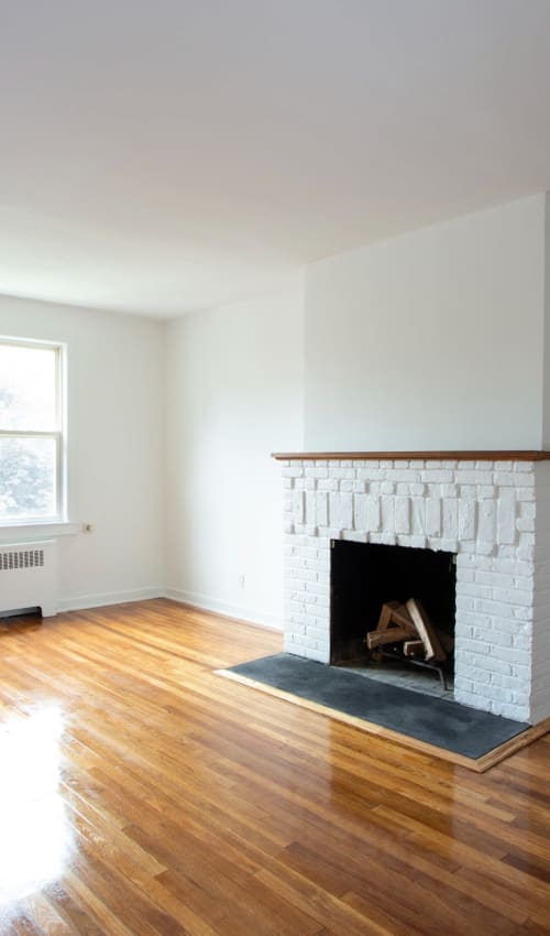 Cozy living room area with a nice fireplace to keep warm with at Eastgold Westchester in Dobbs Ferry, New York