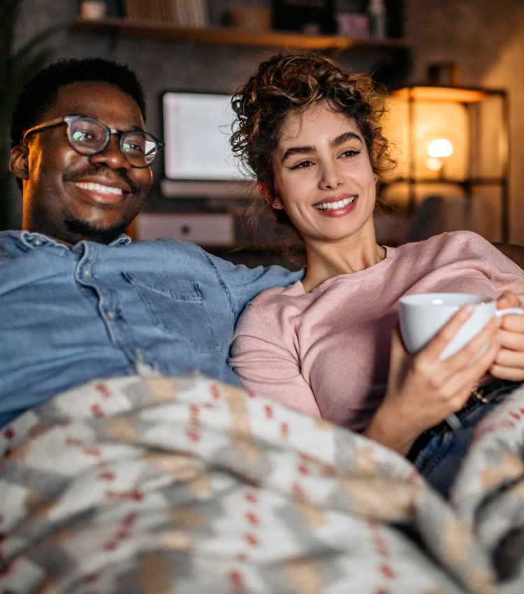 Couple relaxing on their couch at 101 Depot in Smyrna, Tennessee