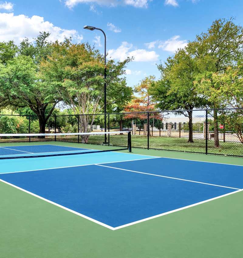 Lighted pickelball court at Villas of Preston Creek in Plano, Texas
