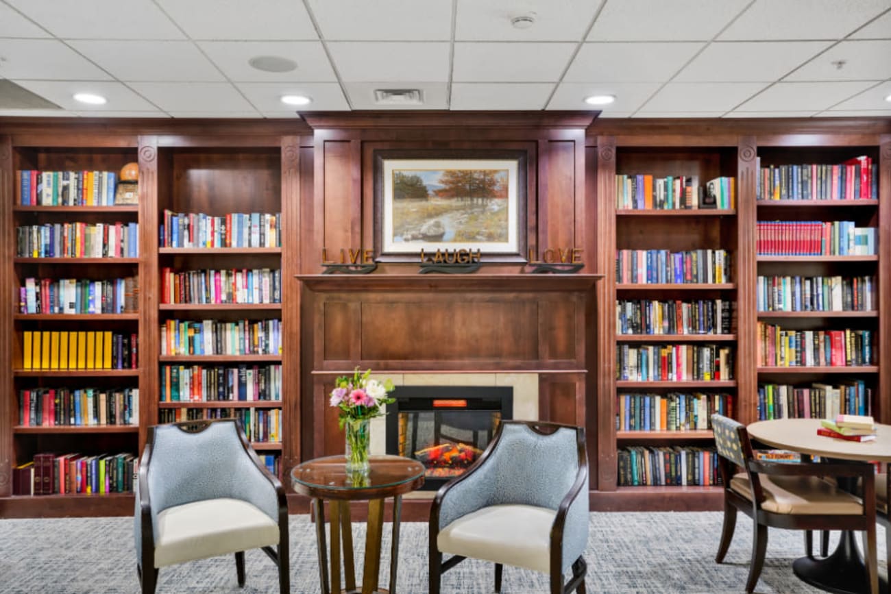 Bookshelves and a fire place at The Inn at Greenwood Village in Greenwood Village, Colorado