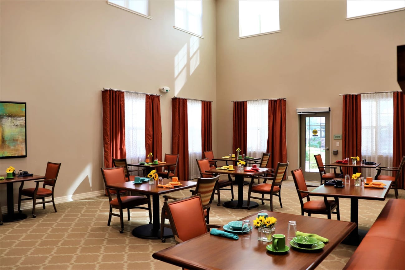 Bright and welcoming dining area with various seating options at Savanna House in Gilbert, Arizona 