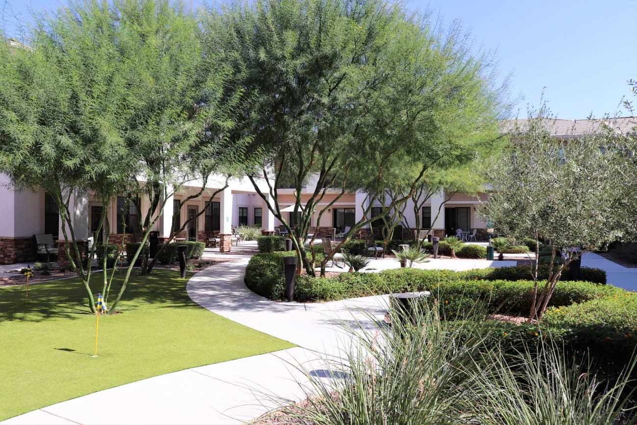 Beautifully manicured lawns and mature trees throughout the community at Savanna House in Gilbert, Arizona