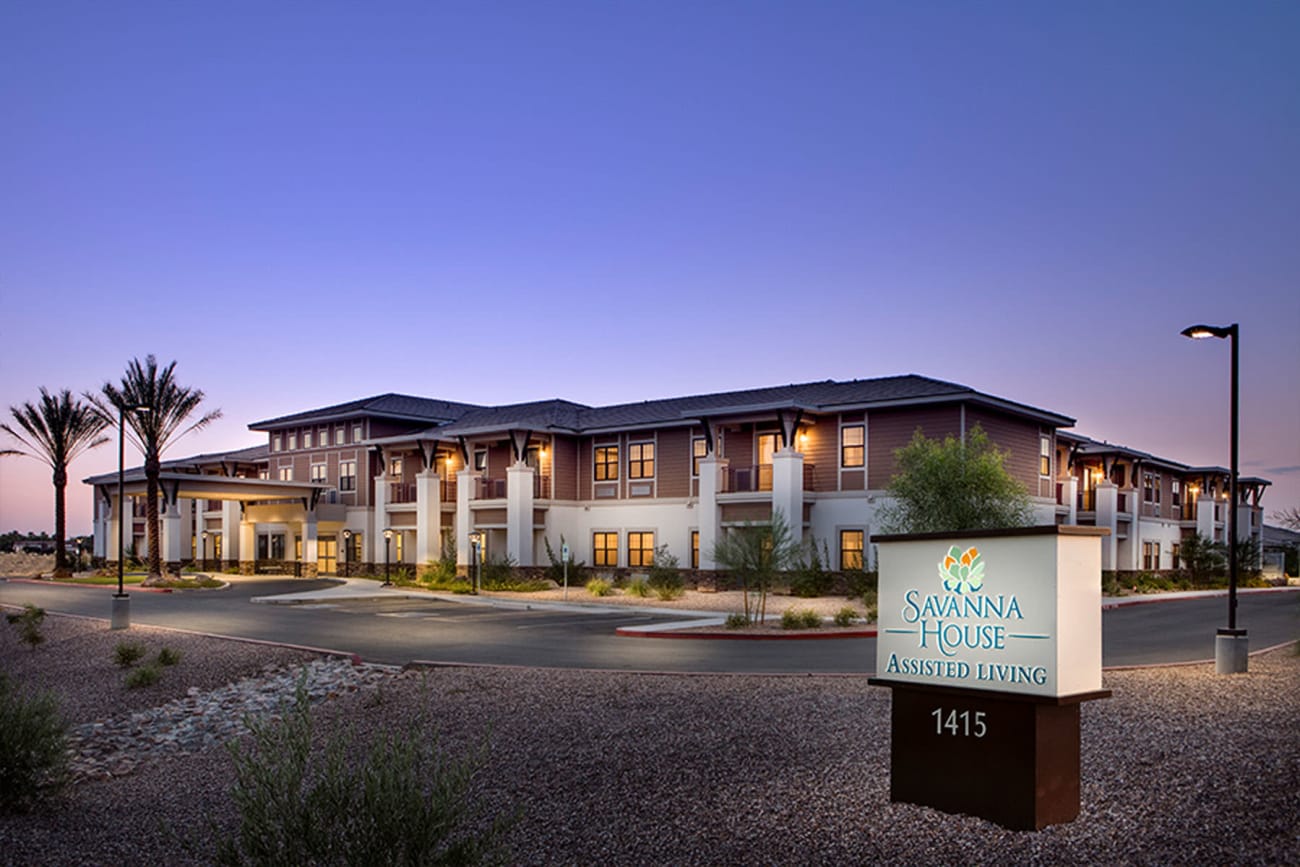 Twilight view of our community with the evening lights on at Savanna House in Gilbert, Arizona