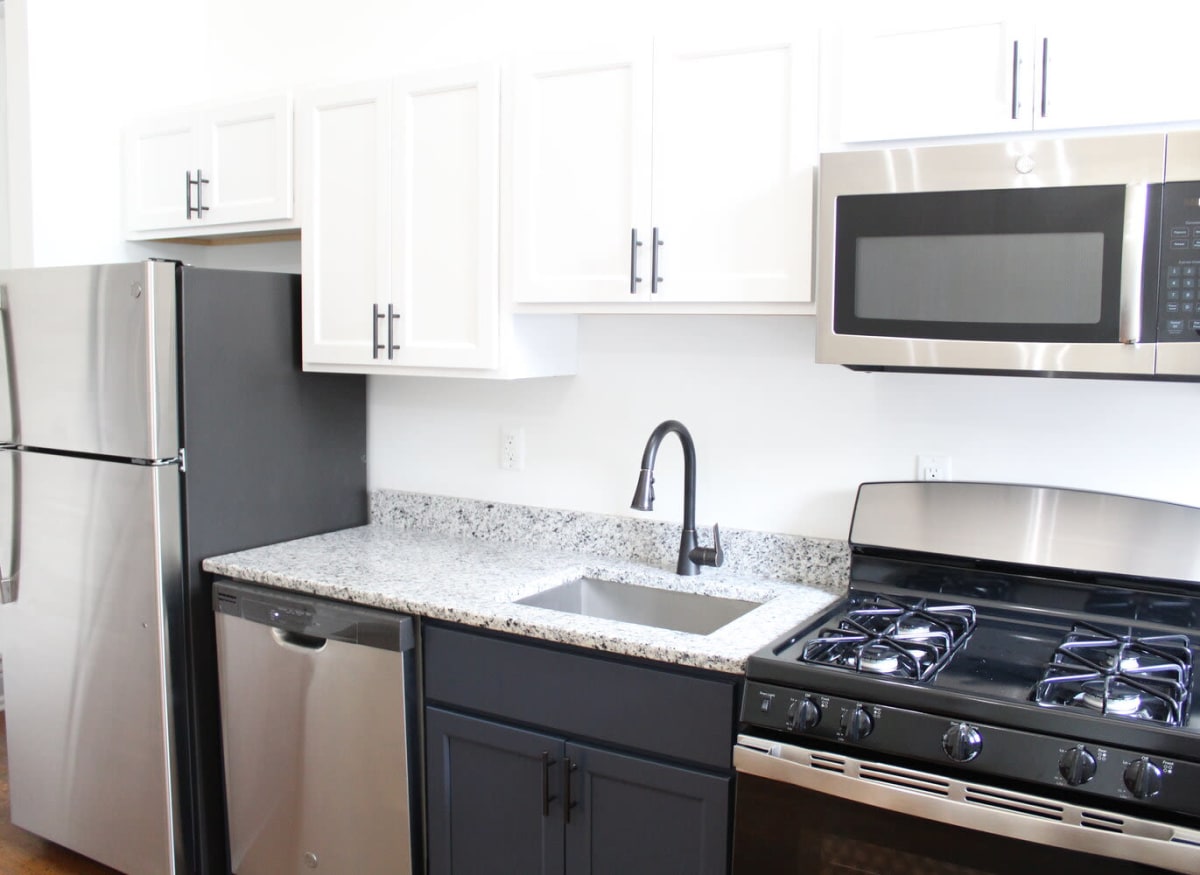 Model kitchen with new stainless steel appliances at The Maven @ 806 in Louisville, Kentucky
