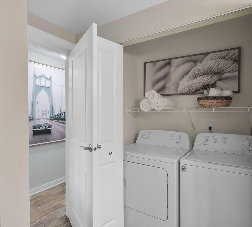 State-of-the-art Whirlpool washer and dryer in a luxury model home at Centro Apartment Homes in Hillsboro, Oregon