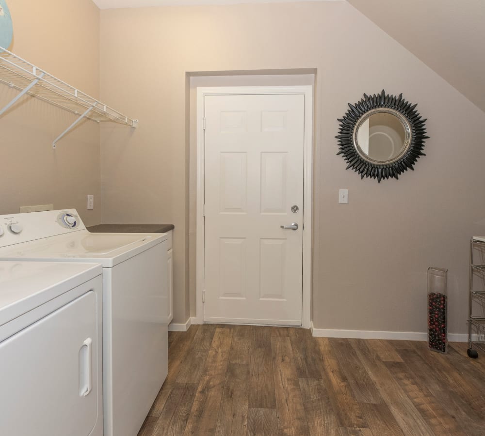 Laundry room with a washer and dryer at Cross Pointe Apartment Homes in Antioch, California