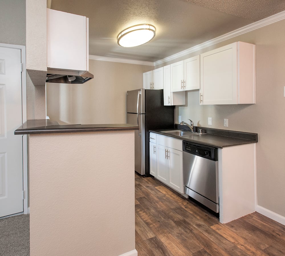 Kitchen with white cabinets at Plum Tree Apartment Homes in Martinez, California