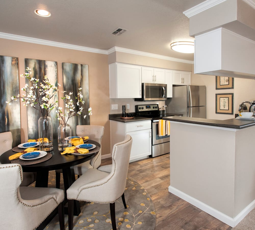 Kitchen with white cabinetry and stainless-steel appliances at The Reserve at Capital Center Apartment Homes in Rancho Cordova, California