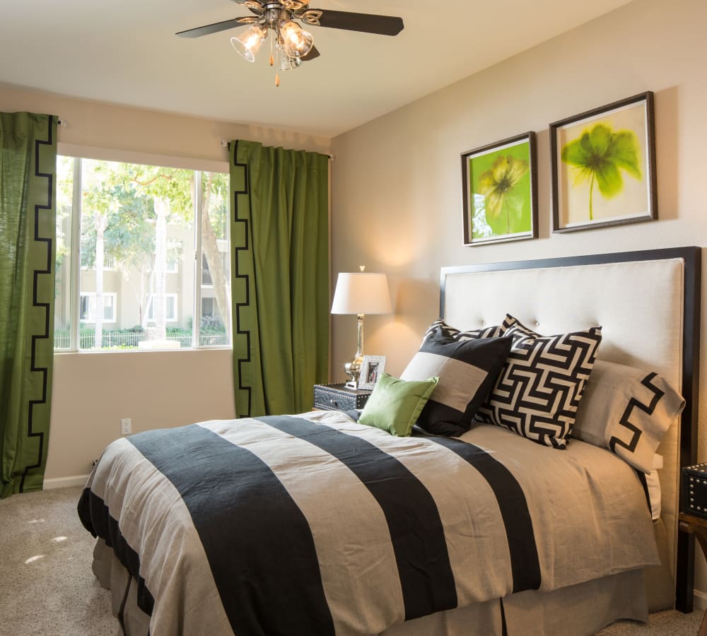 Main bedroom with plush carpeting at Alicante Apartment Homes in Aliso Viejo, California