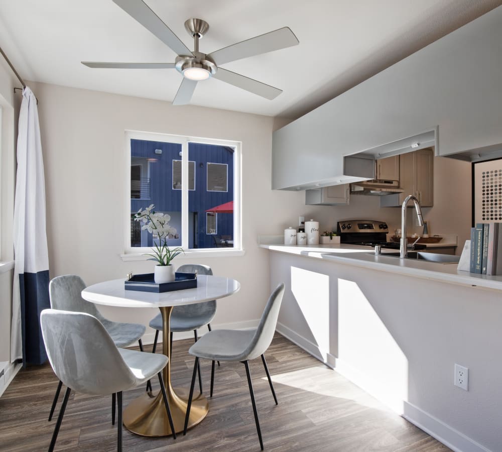 View of the modern kitchen over the breakfast bar of a model home at Sofi Lakeside in Everett, Washington