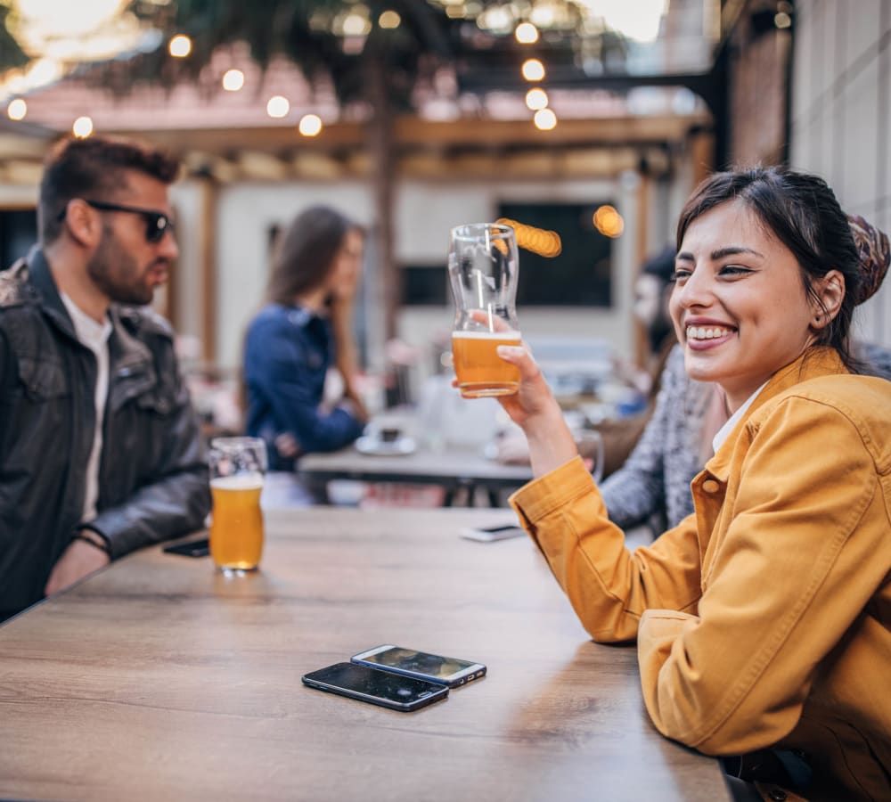 Woman enjoying a beer in Laurel, Delaware near Hollybrook Farms Apartments