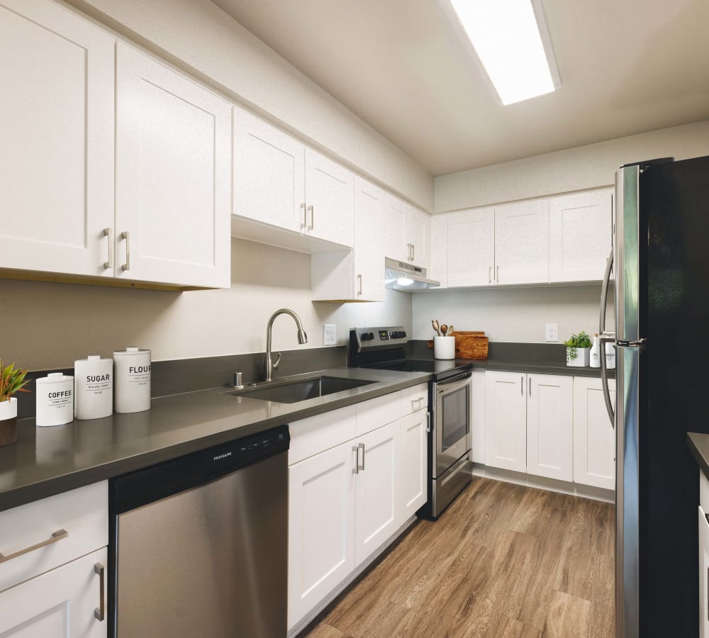 Spacious kitchen with stainless steel appliances, including dishwasher and refrigerator at The Villas at Woodland Hills in Woodland Hills, California