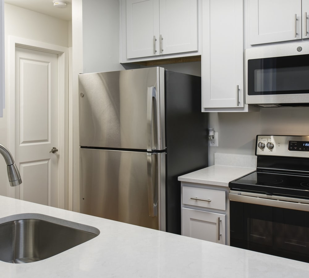 Stainless steel appliances in an apartment kitchen at Stonecreek Club in Germantown, Maryland