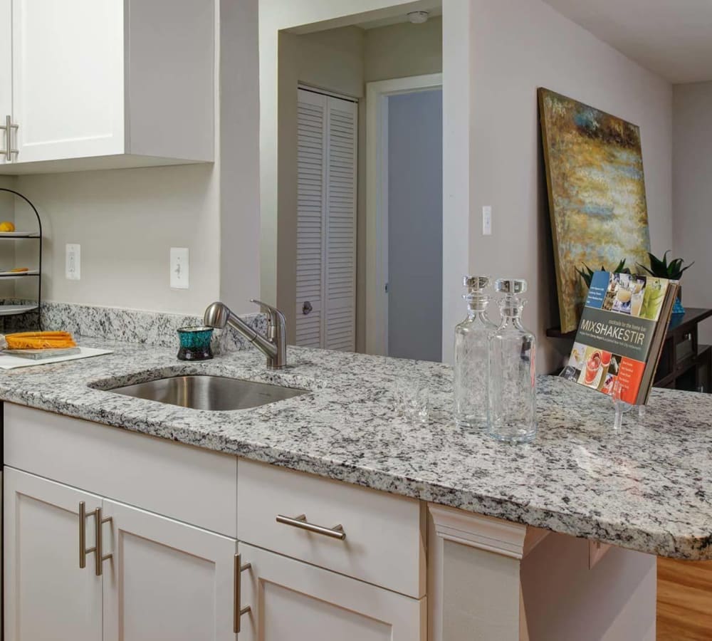 A granite countertop in an apartment kitchen at Hunt Club in Gaithersburg, Maryland