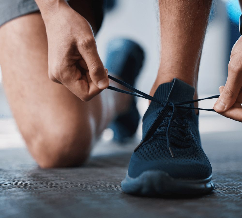 Lacing up sneakers for the gym at Shaff Square Apartments in Stayton, Oregon