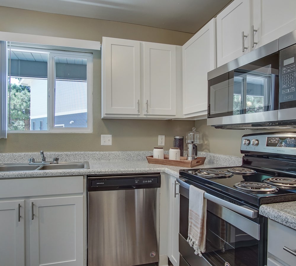 Kitchen with modern appliances at Marina's Edge Apartment Homes in Sparks, Nevada