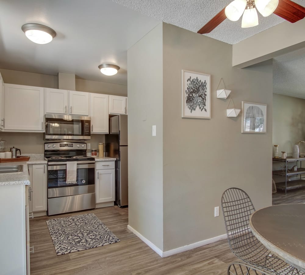 Dining area with kitchen space at Marina's Edge Apartment Homes in Sparks, Nevada