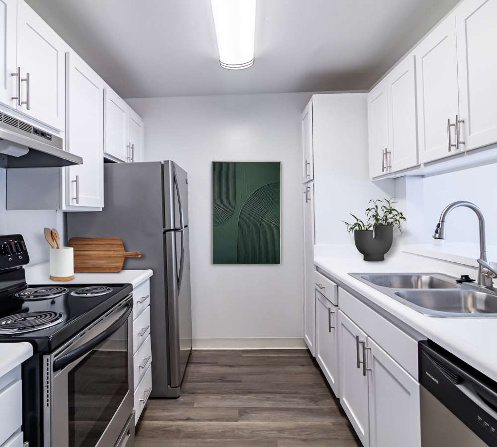 Kitchen with modern appliances at The Ralston at Belmont Hills in Belmont, California