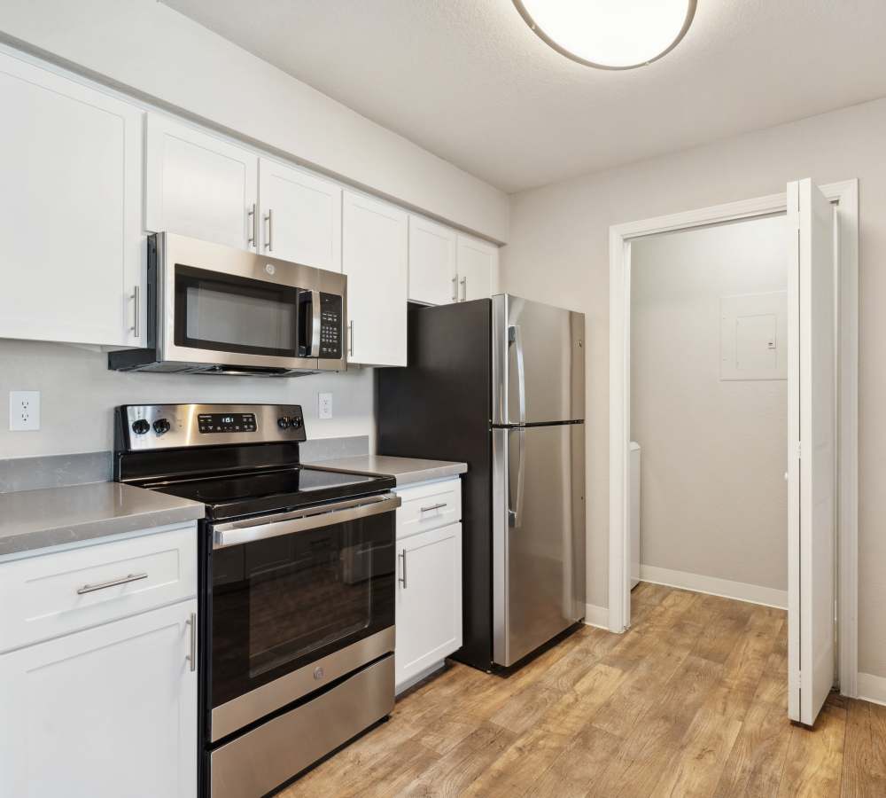 Renovated kitchen with quartz countertops at The Reserve at Capital Center Apartment Homes in Rancho Cordova, California