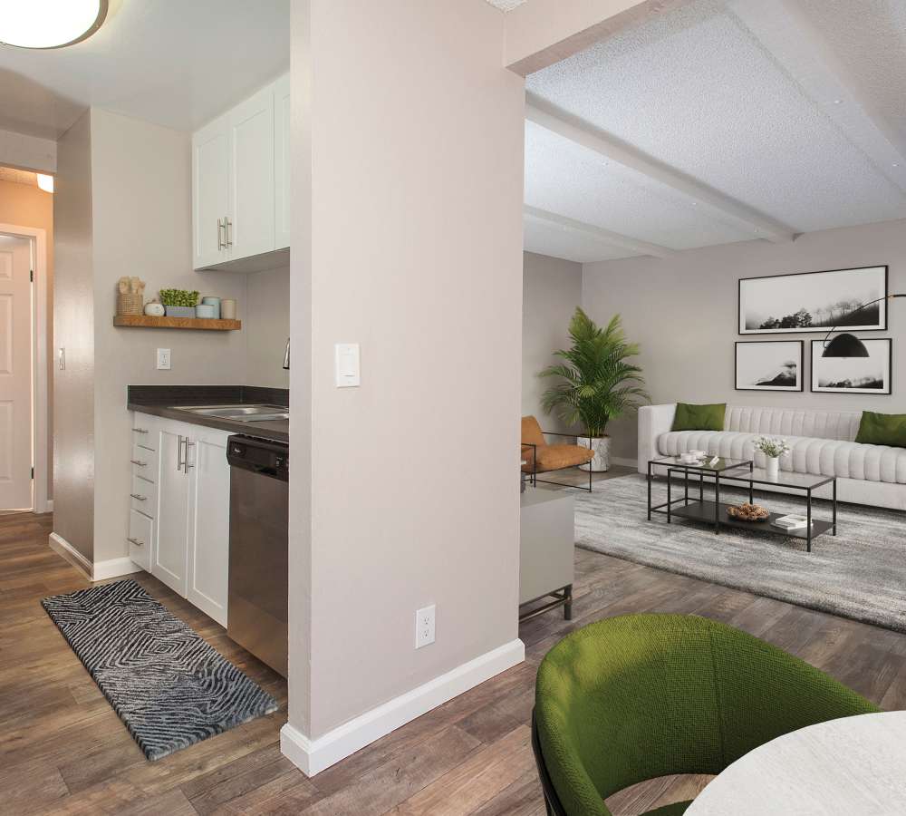  Renovated, furnished living room, dining room, and kitchen at Shadow Oaks Apartment Homes in Cupertino, California