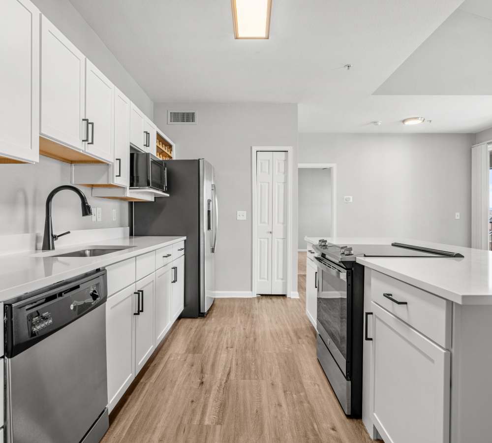 Upgraded Kitchen With Large Breakfast Bar at Briargate on Main in Parker, Colorado