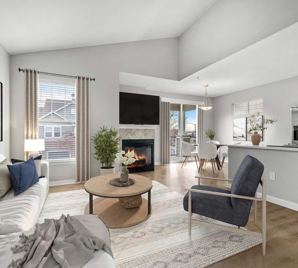 Newly Renovated Living Room With Hardwood Style Flooring and Fireplace at Briargate on Main in Parker, Colorado
