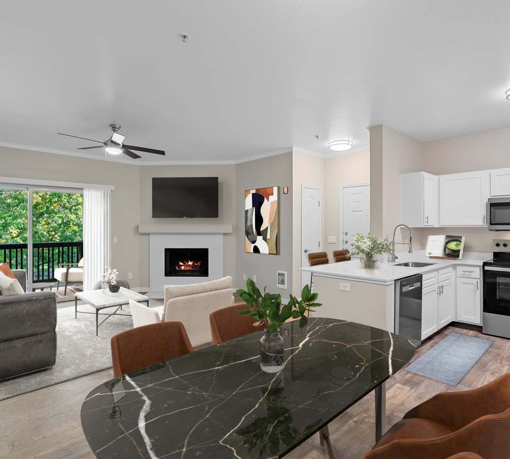 Living room with patio access at Cortland Village Apartment Homes in Hillsboro, Oregon