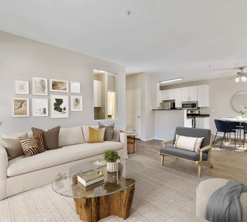 Spacious living & dining room with wood-style flooring and a ceiling fan at Rosewalk in San Jose, California