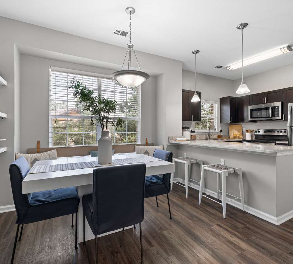 Model home with upgraded kitchen and dining room at Isabella Apartment Homes in Greenwood Village, Colorado