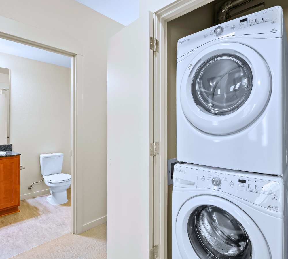 Spacious living room with a patio access at Eddyline at Bridgeport in Portland, Oregon