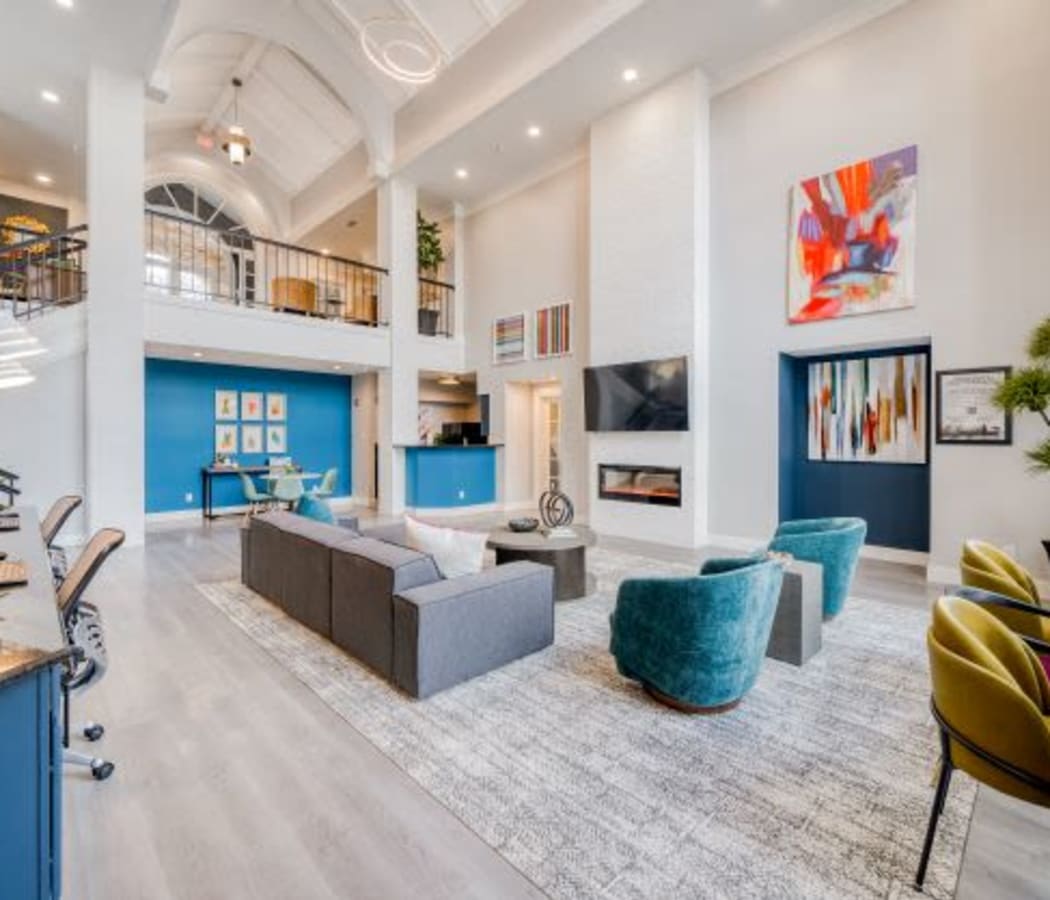 Clubhouse lounge area with a fireplace at The Views at Laurel Lakes in Laurel, Maryland