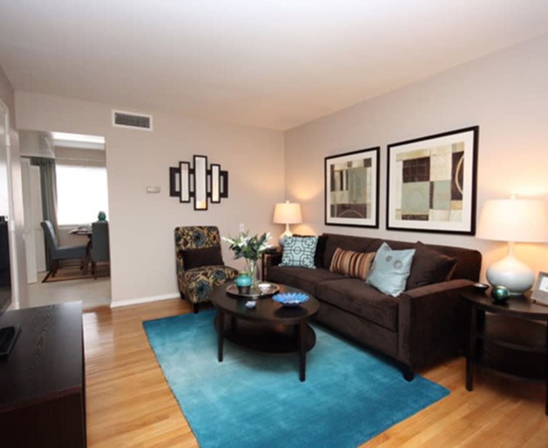 Model living room with hardwood floors at James River Pointe in Richmond, Virginia