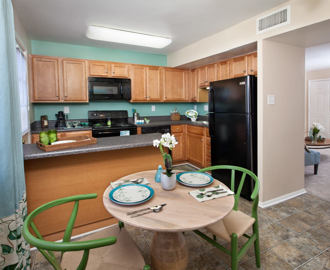 Beautiful modern kitchen with breakfast bar and modern appliances at Springhouse Townhomes in Allentown, Pennsylvania