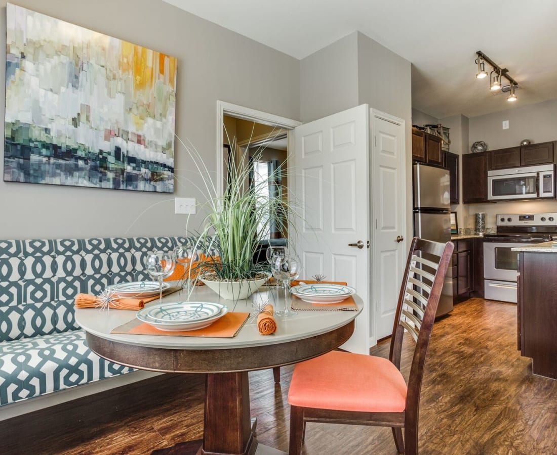 Fun and sophisticated furnishings in a model home's dining room at Parkside Towns in Richardson, Texas